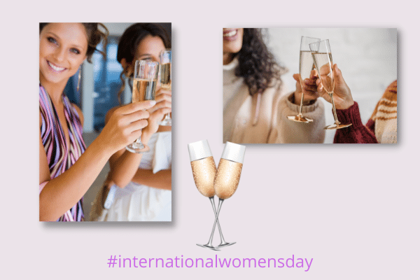 Two groups of women clink champagne glasses, celebrating International Womens Day on a South Carolina vacation.