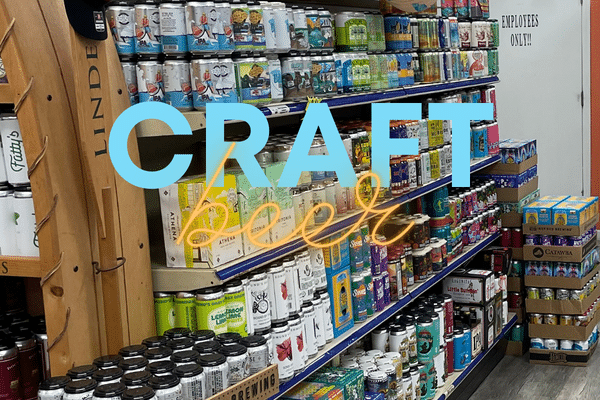 Store shelves filled with colorful craft beer cans and boxes, perfect for a Lowcountry family vacation.
