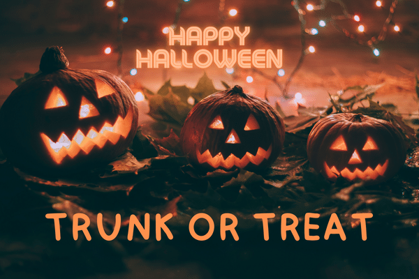 Three glowing jack-o-lanterns with Happy Halloween and Trunk or Treat text, surrounded by autumn leaves and lights.