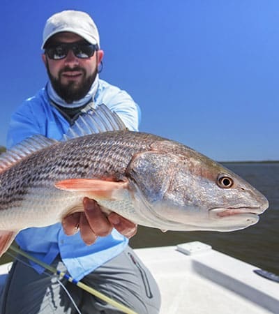 Fisherman with a large redfish