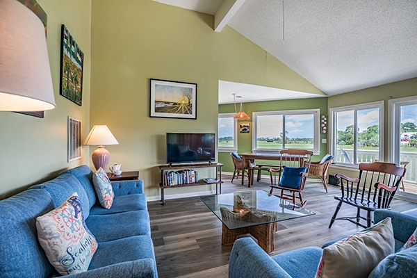 Sunny living room with large windows, and great Fripp Island marsh views.