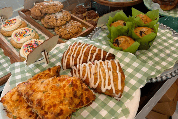 Assorted baked goods including scones, muffins, and cookies ready for a delicious beach vacation.